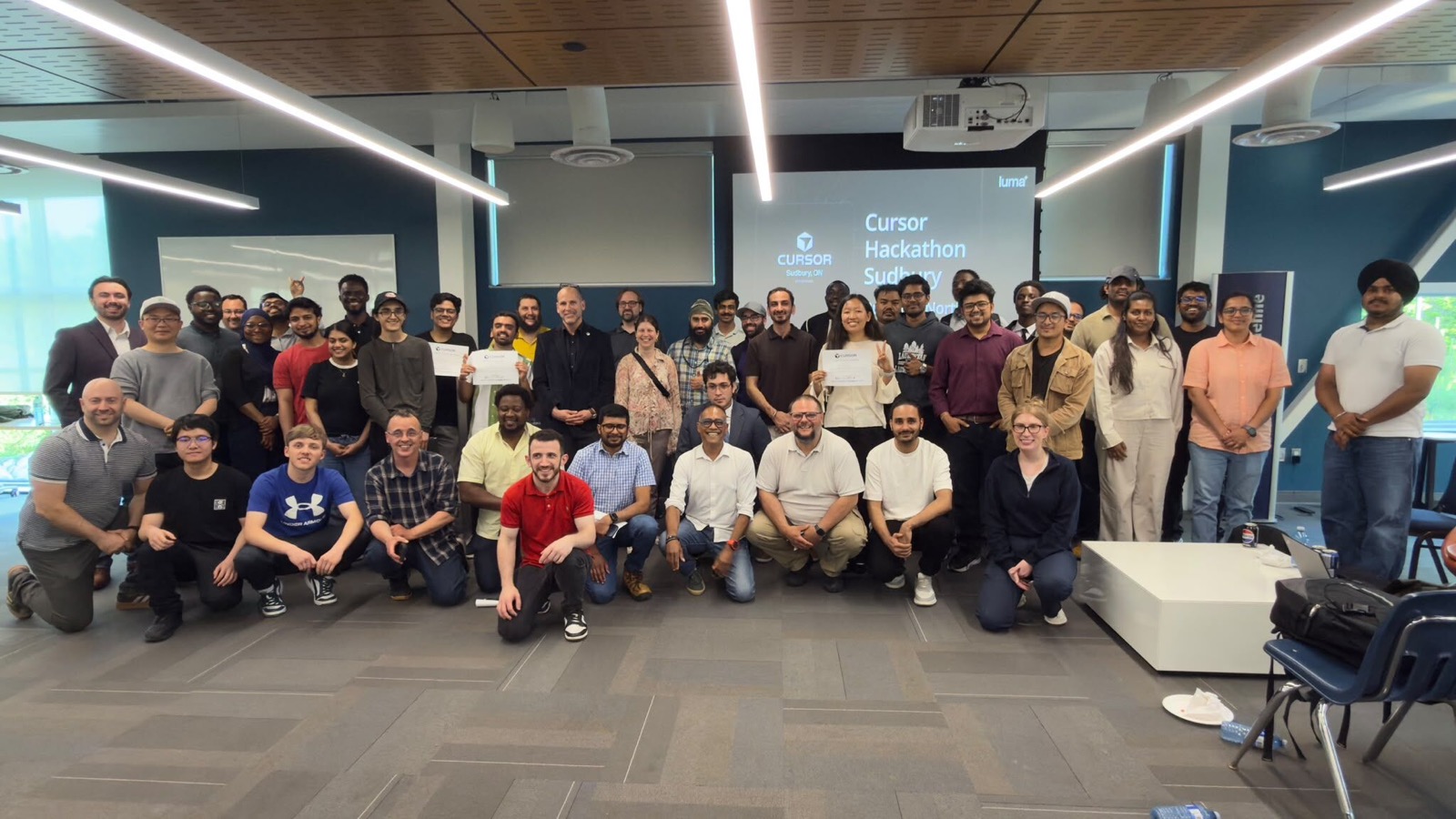 Participants, judges, mentors, and organizers of Cursor Hackathon Sudbury 2026 gathered for a group photo